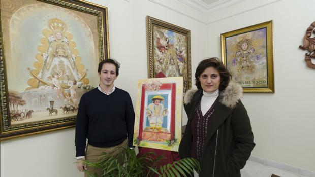 José Miguel Saavedra, delegado de Formación de la Matriz y Juana Acosta la artista almonteña artífice de la felicitación navideña